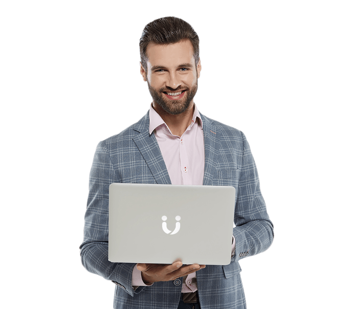 Smiling employee holding laptop